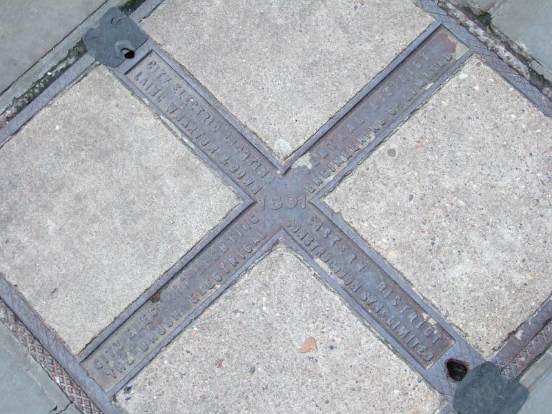 DSCF5900.JPG - This is in the heart of the City.  It's dated 1891 and seems to designate quadrants supplied by different companies.
